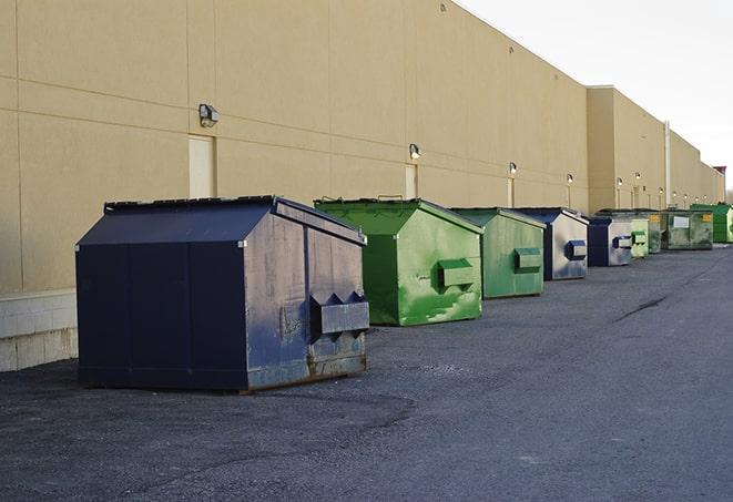 a group of construction workers taking a break near a dumpster in Canyon Lake